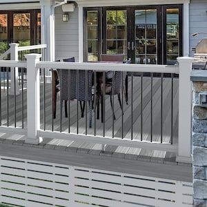 White Deck Railing With Black Spindles, Black Spindles, Vinyl Deck Railing, Deck Railing Kits, Deck Railing Systems, Deck Skirting, Vinyl Deck, Vinyl Railing, Pvc Decking