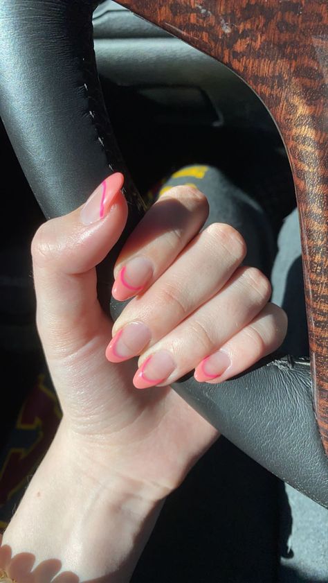 Girl with fair skin holding bottom of steering wheel showing acrylic nails designed with French tips in two different tones of pink, a peachy pink and a hot pink 2 Tone French Tip Nails, Nails Short Almond Shape, French Tip Acrylic Nails Short, Acrylic Nails Short Almond, Short Almond Shape, Acrylic Nails Short, Nails Short Almond, French Tip Acrylics, Short Almond