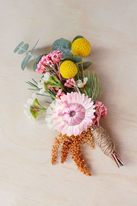 A grooms buttonhole for a wedding featuring colourful Australian native flowers. Billy Button Bouquet, Australian Native Flower Wedding, Native Buttonhole, Bush Wedding Australian, Native Australian Bouquet, Australian Native Flowers Wedding, Spring Flowers Names, Hannah Flowers, Native Bouquet