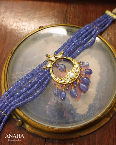 Tanzanite is an extraordinary gemstone, renowned for its ability to display different colors when viewed from various angles. It has long been one of our favorite gemstones, especially when paired with classic Chandbalis-inspired chokers. The design features intricate floral motifs, with faceted tanzanites adding a touch of brilliant color, creating a truly beautiful and distinctive piece. • • • • • • #anahakundanjewelry #simrangosal #bridesofindia #bridaljewellery #weddinginspiration ... Gold Jewelry Outfits, Beads Collection, Antique Jewellery Designs, Tanzanite Jewelry, Heritage Jewellery, Pearl Necklace Vintage, Art Deco Bracelet, Beads Jewellery, Beautiful Waterfalls