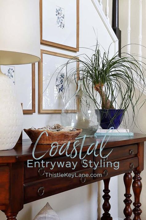 Neutral Coastal Entryway Styling - try these simple styling ideas for your entryway to get those laid back summer coastal vibes flowing. Subtle Coastal Style Decorating. Coastal Entry Table Decor, Coastal Foyer Table Decor, Long Entry Hallway Ideas Coastal, Wallpaper Entryway Foyers Coastal, Coastal Entry Table Beach, Coastal Small Entry Table, Coastal Entryway Ideas, Coastal Foyer, Entryway Styling