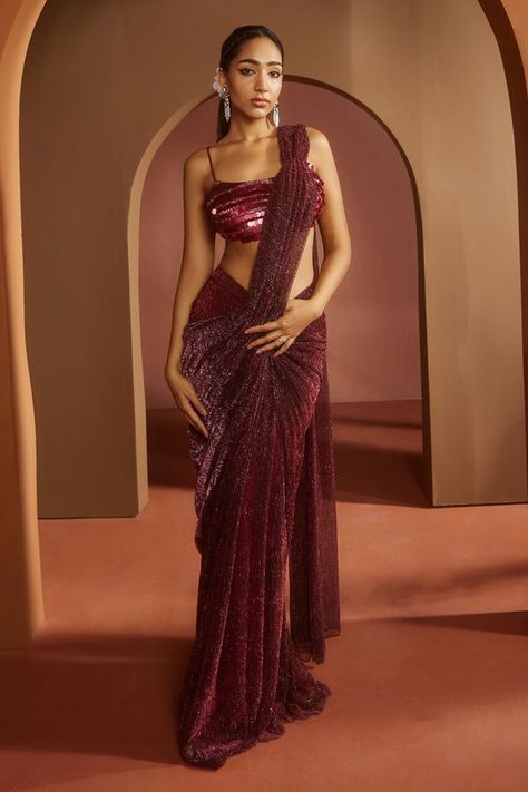 Maroon pre-draped saree in lurex. Paired with a bralette-style blouse featuring dramatic coin-like sequin all over with adjustable noodle straps. Components: 2 Pattern: Embroidered Type Of Work: Sequin Neckline: Square Sleeve Type: Sleeveless Fabric: Lurex, Satin Color: Maroon Other Details: Attached lining Model height: 5ft 9inches, wearing size S Occasion: Sangeet - Aza Fashions Saree Branding, Indian Lehangas, Cocktail Sarees, Draped Sarees, Pre Draped Saree, Simple Dress For Girl, Sequins Saree, Draped Saree, Saree Draping Styles