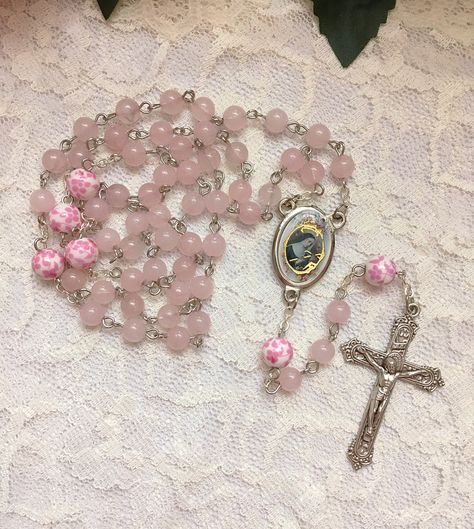 Handmade St. Rita of Cascia rosary beads made with 6mm pink Rose Quartz beads and 8mm ceramic pink & white floral beads. The center and crucifix are both made in Italy. Pink Rosary Aesthetic, Rosary Aesthetic, Rita Of Cascia, Pink Rosary, Flower Rosary, Saint Rita, St Rita Of Cascia, Pink Core, Church Aesthetic