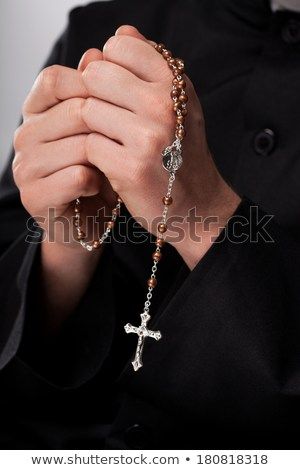 Priest is holding the rosary and praying Praying Hands Drawing, Action Pose Reference, Hand Drawing Reference, Praying The Rosary, Hand Reference, What To Draw, The Rosary, Human Poses, Cool Poses