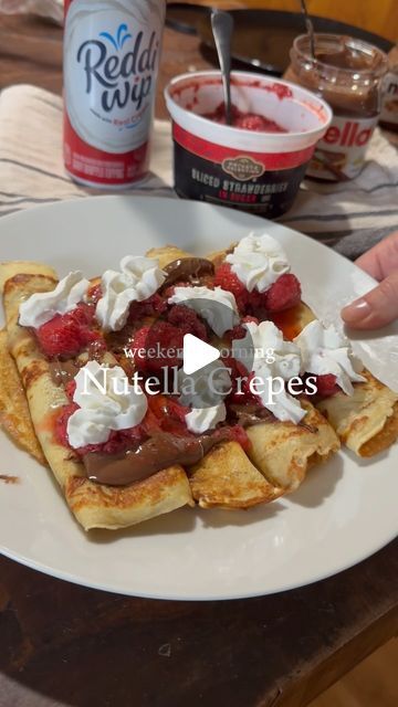 @the.hungry.hostess on Instagram: "STRAWBERRY NUTELLA CREPES

Ingredients:
- 1.5 cups all purpose flour 
- 2 cups milk
- 2 eggs
- 2 tablespoons butter, melted
- 1 tbsp granulated sugar
- 1/2 tsp baking powder
- 1/2 tsp salt
- 1/2 tsp vanilla

Toppings:
- Nutella
- Sliced strawberries in sugar, thawed from frozen
- Whipped cream

Instructions:
1. In a medium bowl mix all of the above ingredients and whisk until there are no lumps left
2. Lightly butter a 6-8 inch skillet over medium heat until bubbly. 
3. Add about 1/4 c batter into the skillet for each crepe, rotating the pan to ensure batter is distributed evenly and covers the bottom. Cook until light brown. 
4. Flip and cook the other side until light brown. 
5. Repeat steps 2-4 for each crepe, stacking the finished crepes between sheet Crepe Ingredients, Strawberry Nutella, Nutella Crepes, Sliced Strawberries, All Purpose Flour, 2 Eggs, Granulated Sugar, 2 Cups, Purpose Flour