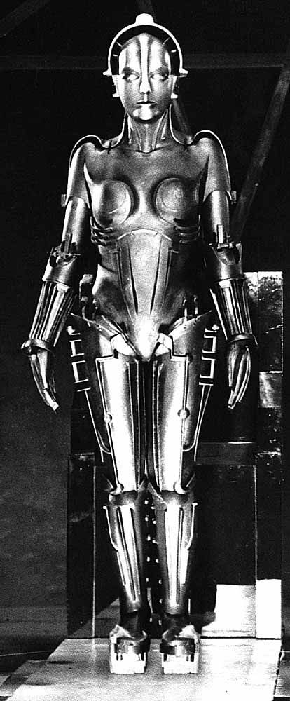 A representation of the Cyborg via Metropolis. Cyborg theory was created by Donna Haraway in order to criticize traditional notions of feminism—particularly its strong emphasis on identity, rather than affinity. She uses the metaphor of a cyborg in order to construct a feminism that moves beyond dualisms and moves beyond the limitations of traditional gender, feminism, and politics. Brigitte Helm, Metropolis Film, Mystic Woman, Metropolis 1927, Robot Suit, Fritz Lang, Fantasy Stuff, Movie Moments, A Robot