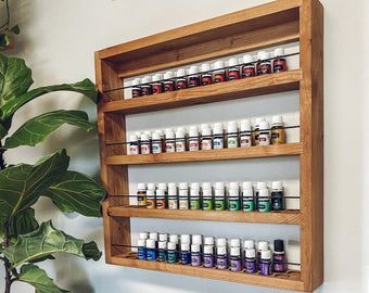 Essential Oil Shelf Display, How To Organize Essential Oils, Essential Oil Shelves, Cheese Board Table, Essential Oils Shelf, Orange Shelves, Meat And Cheese Board, Essential Oil Rack, Beauty Display