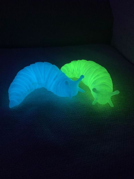 Unique JUMBO 3D printed toy slug that helps with fidgeting and stress relief. Multiple colors to choose from so you can customize your slug. 🐛 Comes in glow in the dark blue or green! Just place under UV light or sunlight for it to glow. (UV Blacklight Included) The slug is about 7 inches long and moves all around. Made with Eco Friendly PLA Plastic Thanks for visiting! Let me know if you have any questions, always happy to help. Fidget Slug, Cool Fidget Toys, Halloween Orange, Pink Halloween, Slug, Green Item, Black Light, Daughter Love, 3d Printed