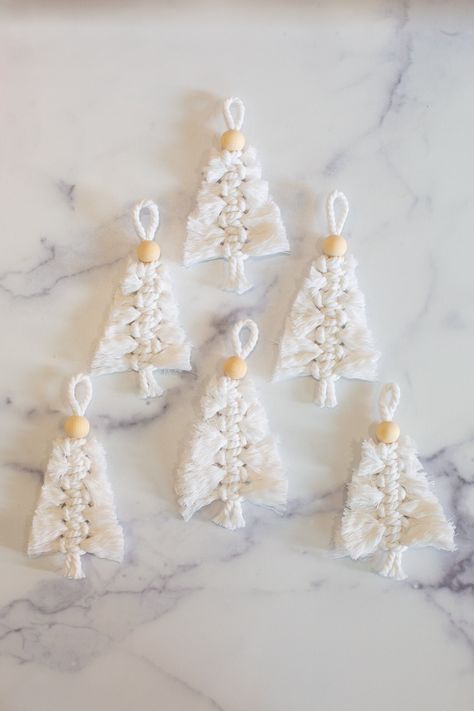 These woven Christmas trees make lovely decor, present toppers, or gifts. Click to learn how to make macrame Christmas ornaments. They're easy to make and look beautiful as holiday decor. Macrame Christmas Knomes, Easy Macrame Christmas Decorations, Christmas Macrame Decorations, Easy Christmas Macrame Ideas, Easy Macrame Christmas Ornaments, Easy Macrame Ornaments, Easy Macrame Christmas Tree, Makramee Christmas, Macrame Ornaments Diy