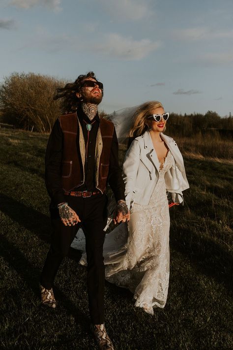 Groom in cowboy Western wedding outfit with the bride in a lace wedding dress wearing a white leather jacket | Firewood Film Groom Cowboy Outfit, Cowboy Boots Wedding, Cowboy Groom, Goth Cowboy, Wedding Cowboy Boots, Lets Get Married, Wedding Sunglasses, Rock N Roll Wedding, Cowboy Jacket