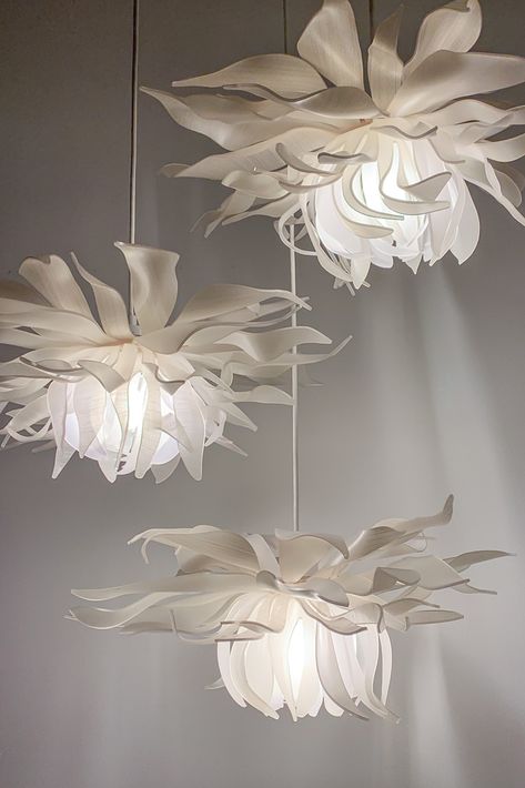 A highlight of LightArt's Artisan Collection, the Botanical Series features dazzling pendants inspired by the floral form. The Chartreuse Blossoms in creamy whites with subtle textural layers create an ethereal glow when illuminated. #interiordesign #architecture #design #lighting #handmade Flower Ceiling Lamp, Diy Ceiling Lamp, Elegant Lighting Fixtures, Fleurs Diy, Home Decor Aesthetic, Flower Lamp, Deco Originale, Belek, Giant Flowers