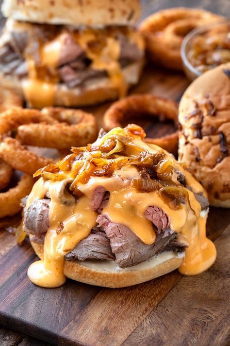 Roast Beef Sandwich with Cheddar Sauce | The Cozy Apron The Bear Sandwich, Roast Pork Sandwich Recipes, Roast Beef And Cheddar Sandwich, Hot Subs Sandwiches Ideas, Pub Sandwiches, Sandwich Board Ideas, Roast Beef Poboy, Hot Roast Beef Sandwich, Onion Bun