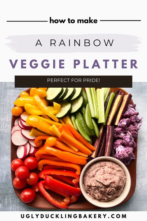 Tomatoes, radishes, red peppers, orange peppers, carrots, yellow peppers, cucumber slices, snap peas, celery, purple carrots, and purple cauliflower florets arranged in rainbow order from left to right on a square wood plate. There is a small bowl of hummus in the lower right corner. The title reads “How to Make a Rainbow Veggie Platter. Perfect for Pride!” and the website uglyducklingbakery.com is below. Fruit Rainbow Platter, Rainbow Veggie Tray, Hummus And Veggies, Rainbow Recipes, Rainbow Bread, Veggie Platter, Crudite Platter, Pride Party, Make A Rainbow