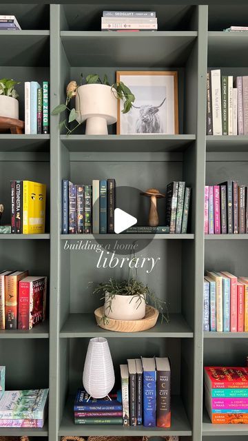 Dominique on Instagram: "We built a home library! 

I dreamt up this idea to house my ever growing book collection, and we came up with a plan to build this custom shelving for this wall in our home. 

-We started by building three separate bookcases with 2x12” pine boards that would fit in this space
-The bookcases sit on a 4” base built out of pine
-We anchored the bookcases to eachother and to the wall with small wood slats at the back of 6 shelves, making sure these were drilled into studs 
-We brad nailed 2” moulding to the front of the bookcases to hide the joints 
-Colour is Sanctuary by Beauti-Tone paints, which is my most favourite green 

We still have to finish the top of the sliding barn door but we ran out of wood 🙃 

Of all our projects, this has been the most smooth sailing Green Library Shelves, How To Build A Library Wall, Green Bookshelves, Green Library, Custom Shelving, Library Shelves, Library Wall, Pine Boards, Smooth Sailing