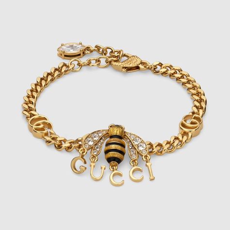 Bracelet with bee pendant and Gucci script in gold-toned metal | GUCCI® US Gucci Bee, Jewelry Gucci, Gucci Bracelet, Fall Rings, Bee Jewelry, Bee Pendant, Necklaces And Bracelets, Gucci Fashion, Rose Gold Jewelry