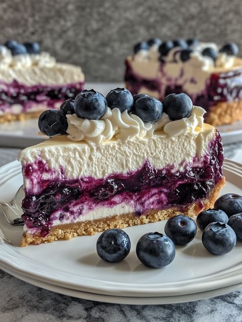 Blueberry Swirl Cheesecake with Silky Topping 🫐   🫐 𝗜𝗻𝗴𝗿𝗲𝗱𝗶𝗲𝗻𝘁𝘀 🫐 - 1 1/2 cups graham cracker crumbs - 1/4 cup granulated sugar - 1/2 cup unsalted butter, melted - 4 (8 oz) packages cream cheese, softened - 1 cup granulated sugar - 1 teaspoon vanilla extract - 4 large eggs - 1 cup sour cream - 1/2 cup heavy cream - 1 cup fresh blueberries - 1/4 cup blueberry jam Blueberry Swirl Cheesecake, Cheesecake Blueberry, Yummy Cheesecake, Swirl Cheesecake, 귀여운 음식 그림, Homemade Cheesecake, Blueberry Sauce, Blueberry Jam, Beautiful Desserts