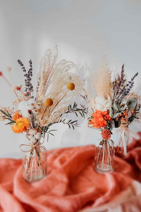 Our gorgeous bouquets and centerpieces for tables will make your special event even more beautiful and memorable! Centerpieces are very important pieces of decoration because they draw attention to the tables and bring event decor together. Impress your guests and add more life to the event venue with our beautiful dried flowers bouquets! Boho Spring Bouquet, Jars With Flowers Centerpieces, Orange Ranunculus Centerpiece, Rustic Modern Wedding Centerpieces, Dried Flower Tablescape, Dried Flower Wedding Decor Centerpieces, Dried Floral Wedding Decor, Dried Flowers Table Decor Wedding, Dried Flowers Centerpiece Wedding