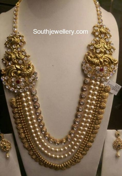 22 carat gold antique layered kasu haram adorned with south sea pearls, polki diamonds and rubies. Kandoli Designs Gold, Pearl Haram Design, 20grams Gold Necklace Designs, Gold And Pearl Necklace, Kasu Mala, Mala Jewelry, Antique Gold Jewelry Indian, Pearl Necklace Designs, Gold Necklace Indian Bridal Jewelry