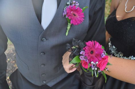 Homecoming time is here!! Order your corsages and boutonnière from countryside florist! Magenta Gerber daisies compliments this black dress! Corsage Homecoming Black Dress, Flowers For Black Dress Prom, Homecoming Corsages Wristlets, Prom Wrist Corsage Ideas Black Dress, Magenta Corsage And Boutonniere, Prom Flowers Bouquet Black Dress, Corsage For Black Dress, Gerber Daisy Corsage, Magenta Corsage