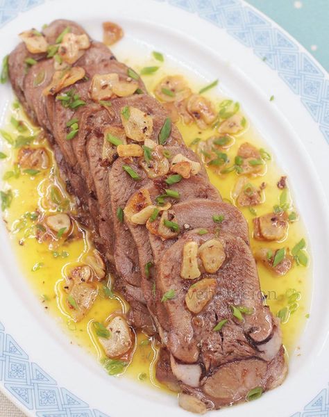 Lightly browned beef tongue slices are smothered with garlic lemon butter sauce. Lengua al ajillo will make a lovely addition to your holiday menu. #beef #holidays #christmas #newyear #recipe Offal Recipes, Beef Tongue, Using A Pressure Cooker, How To Cook Beef, Lemon Butter Sauce, Holiday Menus, Lemon Butter, Butter Sauce, Beef Dishes