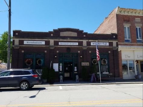 Horsefeathers in central Illinois is an iconic business that's been around since 2004. It is known for its unique antiques and vintage dining that are second to none. Mini Vacation Ideas, Cafe Artwork, Mismatched Furniture, Banks Building, Central Illinois, Vintage Restaurant, Mini Vacation, Old Bricks, Cafe Style