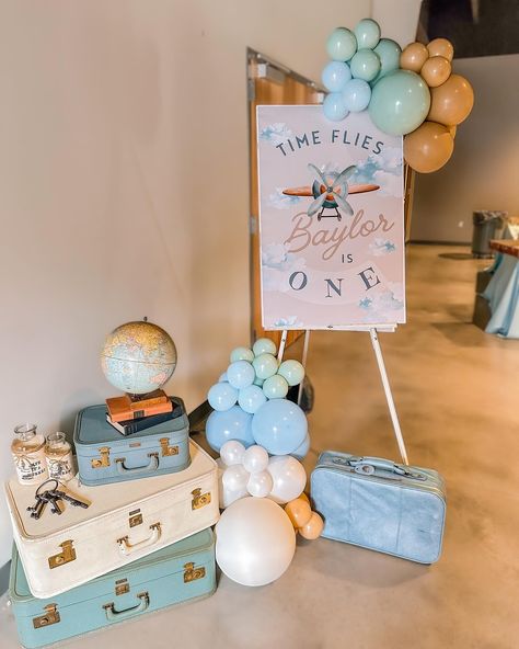 Time Flies When You’re Turning One ✈ | @katieramsey.studiok IN LOVE with Baylor’s 1st birthday!!!🥳 Dreamy vintage travel-inspired theme, complete with clouds, vintage suitcases, and adorable framed signage. Every detail was filled with love and adventure! ✨ ⭑ Suitcases and trinket rentals: @abushelandapeckvintagerentals Ready to create unforgettable memories for your little one’s special day? Let us help you bring your vision to life! 🎈🔗 ✨ | #TimeFlies #FirstBirthday . . . . #Celebrate... Airplane Dessert Table, 1st Birthday Travel Theme, Travel 1st Birthday Party, Plane Party Ideas, Plane Birthday Theme, Time Flies When You’re Turning One, Vintage 1st Birthday Boy, Oh How Time Flies First Birthday, How Time Flies First Birthday