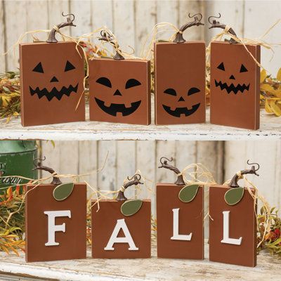 The Fall Pumpkin Blocks are a set of four decorative square wooden blocks with a rust-orange painted finish. The blocks have a reversible design, one side spelling “Fall” in dimensional white letters, and the other with black jack-o-lantern faces. The top of each pumpkin is detailed with a twisted resin stem, raffia tie, and green leaf for a complete look. These blocks are the perfect addition to the home during the Fall and Halloween season, bringing a festive touch to a riser, tray, shelf, or Wood Halloween Decorations Outdoor, Small Fall Signs Wooden Diy, Scrap 1x4 Wood Projects, Fall Wooden Pumpkins, Cool Wooden Projects, Fall Wood Block Crafts, 2x4 Fall Wood Crafts, Halloween Wood Crafts To Sell, Christmas Scrap Wood Projects