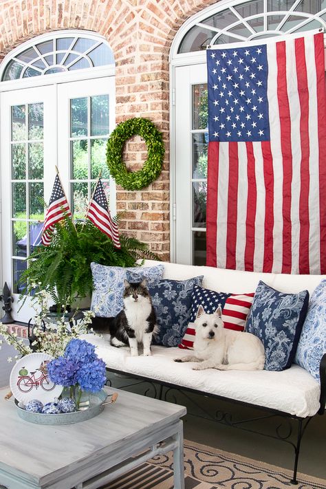 Patriotic Front Porch, Patriotic Porch, Farmhouse Candle Holders, Basket Makeover, Simple Cottage, Porch Table, Coffee Table Makeover, Blue And White Pillows, Fourth Of July Decorations