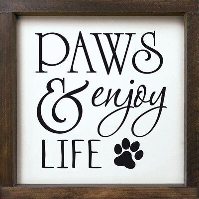 Surrounded by a 2 inch solid knotty frame, this sign offers options of hanging or setting on a flat surface to complete your decorating needs. Frame Color: Walnut Framed, Color: White | Trinx Paws & Enjoy Life (Framed) Wood in White, Size 12.0 H x 12.0 W in | Wayfair | Home Decor Home Decor Sign Ideas, Cute Sign Ideas, Diy Dog Signs Ideas, Puppy Signs Diy, Dog Sayings Signs, Funny Dog Sayings, Cute Dog Sayings Signs, Funny Dog Signs For Home, Funny Dog Signs