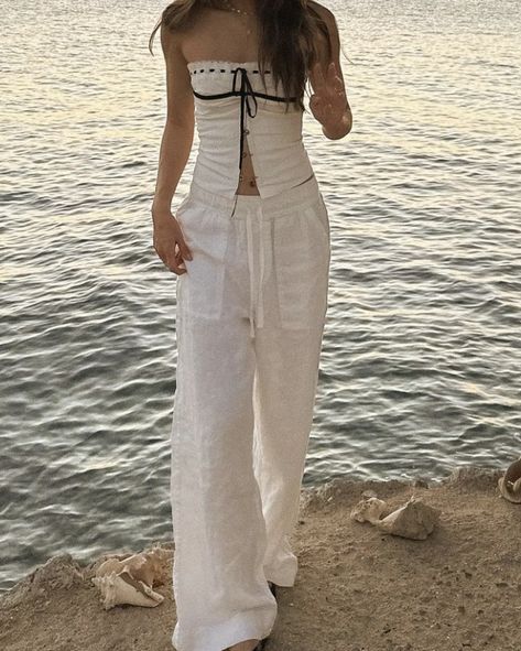 Women's Linen Summer Palazzo Trousers Flowy 2024 summer beach aesthetic cream beige white striped linen trousers outfit suggestions 2024 aesthetic summer evening outfit suggestions shopping suggestions For a chic summer evening look, consider pairing these linen palazzo trousers with a simple white camisole and a statement necklace. Add strappy sandals and a clutch bag to complete the outfit. This combination offers effortless elegance and is perfect for a night out or a special dinner on the be Linen Pants Aesthetic Outfit, Linen Outfits Aesthetic, Trouser Summer Outfits, Linen Trousers Aesthetic, Beige Flowy Pants Outfit, Palazzo Beige Outfit, White Linen Pants Outfit Dressy, White Camisole Outfit, Flowy Outfits Aesthetic