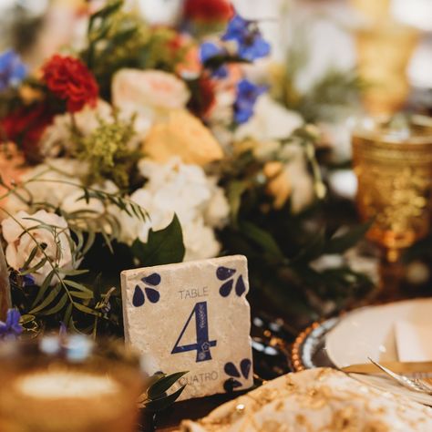 Blue and white table numbers, in the talavera aesthetic, each delicately adored with white flowers and whimsical leaves.  Enjoy these statement table numbers at your wedding, and to use afterwards in your home as a momento from your special day.   --->  (Images are mock ups of a new design that has not been made yet which is why you cannot see the stone pigment and why you can see layering.  One completed, all white/grey background will be stone color and the beige background will have some stome texture). Each table number is a 4"x4" stone tile made from either travertine or marble stone.  This listing is for 10 table numbers.  If you want more or less please message me for a custom order request.  On the back of each tile I can customize a personal logo with your names and the date of th Talavera Table Numbers, Wedding Table Decorations Aesthetic, Clase Azul Wedding, Blue And White Talavera Wedding, Blue And White Mexican Wedding, Blue Talavera Wedding, Talavera Wedding Decor, Spanish Wedding Decor, Wedding Table Numbers Ideas