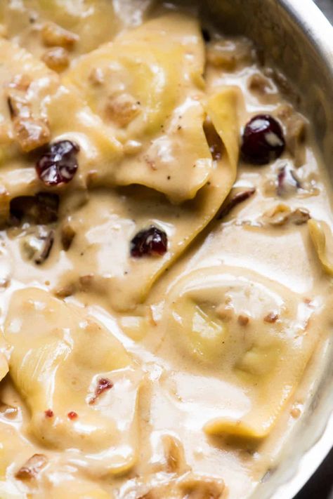 Ultimate fall comfort food! Tender butternut squash ravioli cloaked in rich marsala cream sauce with caramelized onions, dried cranberries and fresh sage. #hungerthirstplay #fallrecipes #comfortfood #pasta #ravioli #butternutsquashravioli #marsala #marsalacreamsauce #fall #autumn #creamypastadishes Marsala Cream Sauce Pasta, Sauce For Butternut Squash Ravioli Cream, Cream Sauce For Butternut Squash Ravioli, Butternut Squash Ravioli Cream Sauce, Butternut Squash Ravioli Recipes Sauces, Sauces For Butternut Squash Ravioli, Squash Ravioli Sauce, Butternut Squash Ravioli Sauce, Butternut Ravioli