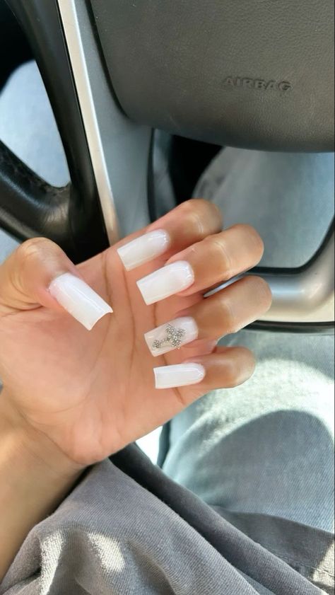 White Nails With Planet Charm, Cute White Nails French Tip, Milky White Nails With Cross, Plain White Nails With Charms, Milk White Nails With Rhinestones, Black And Milky White Nails, White Nails With Cross Charm, Milky White Nails With Gems, White Nails Charms