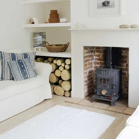 Practical shelving makes the most of the alcove space in this living room, with a large space on the bottom shelf to store logs to fuel the traditional wood-burning stove. Coastal Cottage Living Room, Living Room Coastal, Cottage Living Rooms, Coastal Living Rooms, Coastal Living Room, Cottage Living, Decoration Inspiration, Coastal Cottage, Style At Home