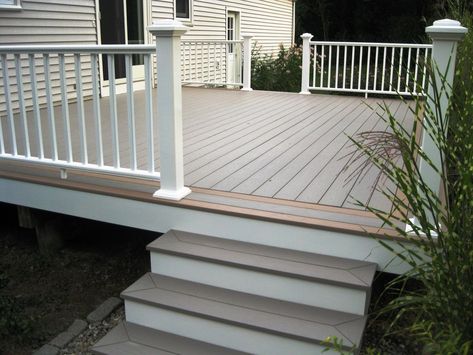 PVC Decking and Rails - Picture 6295 | Decks.com Ground Level Deck With Railing, Trek Deck, Ground Level Deck, Cottage House Exterior, Deck Railing Ideas, Deck Remodel, Patio Railing, Pvc Decking, Deck Pictures