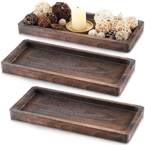 PRICES MAY VARY. Complete Your Space: unveil the charm of natural rustic aesthetics in your space with this set of 3 rectangular decorative trays; Presented in a rustic color that enhances the wood grain, these candle holder trays seamlessly blend with many decor styles, adding a touch of tranquility and warmth; This gives ample opportunity to create layered centerpieces, or to spread the rustic charm throughout different rooms in your home, creating a thematic yet diversified aesthetic Proper S Wood Candle Tray, Coffee Table Fireplace, Table Fireplace, Christmas Kitchen Decor, Rustic Centerpieces, Rustic Colors, Candle Tray, Decorative Trays, Wood Candles