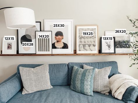 Mix it up! 10 Ways to Display Art in your Home. - Chris Loves Julia Picture Shelf Behind Sofa, Ledge Shelf Over Couch, Photo Ledge Over Couch, Art Ledge Over Couch, Art Ledge Styling, Above Couch Picture Ledge, Photo Ledge Living Room, Picture Ledge Styling Above Couch, Shelf Art Display