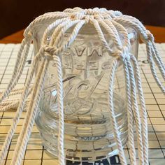 DIY Macrame Glass Jar Covers Made with Square Knots Jar Macrame Diy, Mason Jar Macrame Diy, Macrame Jar Hanger Diy, Macrame Jar Cover Diy Tutorial, Rope Crafts Diy Ideas, Macrame Jar Cover Diy, Mason Jar Macrame, Macrame Bottle Cover, Macrame Glass Jar