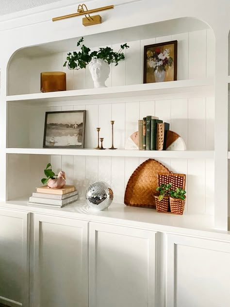 Built In Shelves Living Room Remodel, Cabinet With Shelves Above Living Room, Wrap Around Built Ins, Update Old Built Ins, White Built Ins Living Room, How To Decorate Deep Shelves Built Ins, Built In Book Shelves Living Room, White Built Ins With Wood Shelves, Brick Fireplace Built Ins