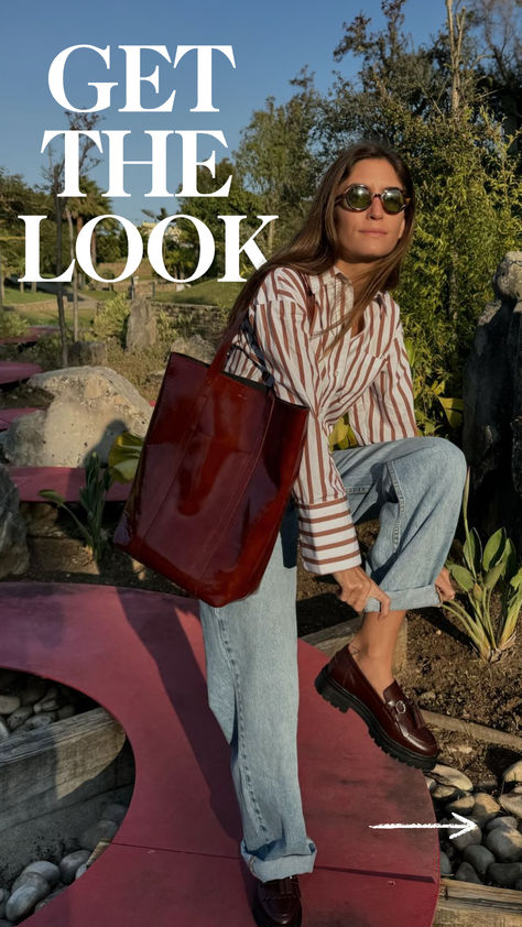 Recreate this effortless Parisian style with Sézane’s Bilma striped shirt, paired perfectly with wide-leg jeans and classic Albane loafers. Complete the look with The Tote in Mahogany and Romie sunglasses for a chic, timeless ensemble. Check out this French-inspired outfit and more at sezane.com or via the app. Sezane Outfit Ideas, Parisian Style Winter Chic, Sezane Style, Sezane Outfit, French Inspired Outfits, Parisian Style Winter, Parisian Style Outfit, Thanksgiving Outfit Ideas, Fall Layering