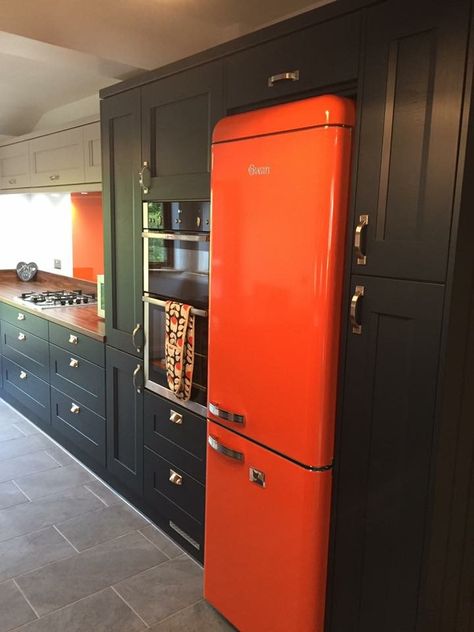 WOW 🖤💛 this kitchen was recently inspected after install for Mr and Mrs L in Chelmsford. It's striking with the splashes of orange in the fridge, glass and stools. The clients opted for two solid wood doors, to add flair to the design. They chose Neff appliances & laminate worktops. A gorgeous kitchen! #orangefridge #kitchendesign #cookaholics www.regalkitchens.co.uk Orange Kitchen Appliances, Kitchen Glass Door, Kitchen Design Images, Laminate Worktop, Tiny House Interior Design, Door Kitchen, Orange Kitchen, Solid Wood Doors, Tiny House Interior