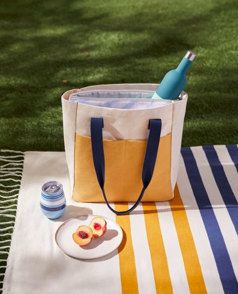 The perfect summer bag does double duty as a stylish cooler thanks to its removable insulating liner that keeps drinks and snacks chilled. Perfect for picnics and days at the beach, it also makes a great market bag. Remove the zippered pouch to use it as a roomy canvas tote with a wide front pocket and tall carry handles #picnic #summer #outdoordining Picnic Summer, Picnic Cooler, Online Shipping, Cooler Tote, Wine Set, Wine Travel, Summer Bag, Zippered Pouch, Cooler Bag