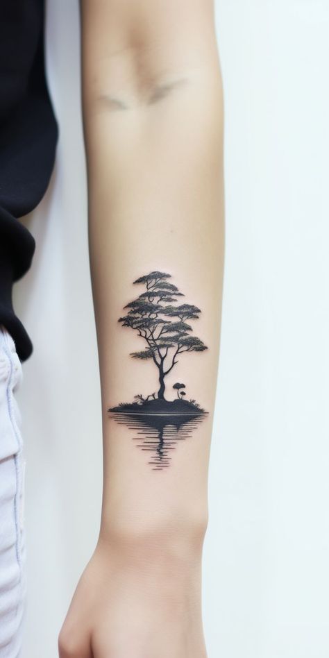 Underarm tattoo showcasing a tree by a peaceful lake, its silhouette mirrored in the water. A design celebrating nature's beauty, growth, and harmony. Geometric Tattoo Tree, Reflection Tattoo, Tree Sleeve Tattoo, Underarm Tattoo, Lake Tattoo, Artsy Tattoos, Earth Tattoo, Inner Forearm Tattoo, Tree Tattoos