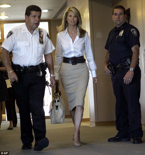 Fight in court: Christie Brinkley is escorted by court officers as she arrives at New York State Supreme Court for the beginning of her divorce trial against Peter Cook in 2008