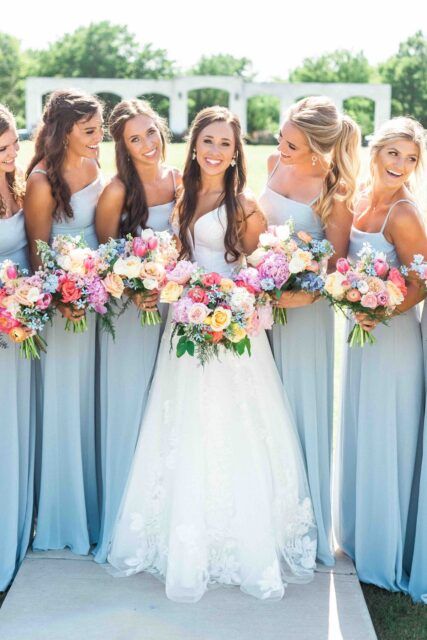 Pastel Tropical Wedding Flowers, Spring Colored Wedding Flowers, Weddings With Colorful Flowers, Summer Simple Wedding Dresses, Dusty Blue With Bright Flowers, April Wedding Colors Bridesmaid Dress, Wedding Flowers For Blue Dresses, Vibrant Spring Wedding Flowers, Colorful Flowers Bridesmaid