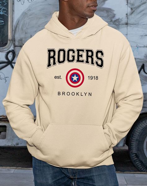 "Rogers Shirt, Captain America Tee, Winter Solider Shirt, Chris Evans Shirt, Barnes and Rogers Shirt, Rogers 1918 Shirt, Avengers Superhero Description Unisex T-Shirt: - 100% Preshrunk Cotton - Heather Colors: are 50% cotton / 50% polyester - Antique Colors :& Sport Grey are 90% Cotton / 10% Polyester - Ash Grey: 99% Cotton 1% Polyester - Classic Fit - 7/8\" Double Needle Topstitched Collar - Double- needle Sleeve and Bottom Hem Hoodie: - 50% Cotton 50%. Polyester. Made by specially spinned Captain America Sweatshirt, Captin America, Philadelphia Sixers, Tyrese Maxey, Avengers Superheroes, Movie Shirts, Chris Evans, Knit Shirt, Ash Grey