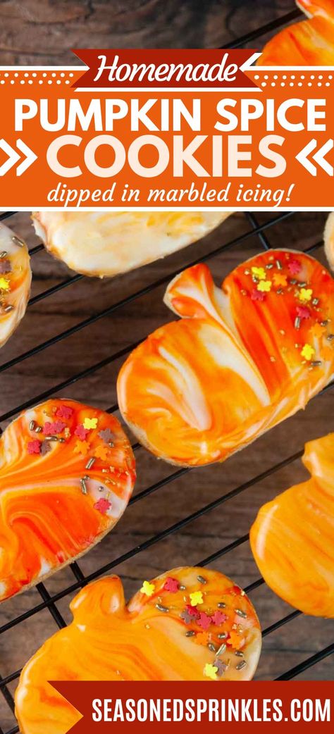 These pumpkin cut out cookies are a hit all fall long with the warming spices. Decorating them is a snap thanks to dipping the baked cookie into the sugar cookie icing for a beautiful marbled finish. #pumpkin #cookie #pumpkinspice #sugarcookie #cookiedecorating #recipe #thanksgiving #fall #halloween Pumpkin Cutout Cookies, Fall Cookie Decorating Ideas, Fall Cookies With Sprinkles, Thanksgiving Cutout Cookies, Pumpkin Spice Cookies With Icing, Marble Icing Cookies, Pumpkin Spice Roll Out Cookies, Pumpkin Spice Cut Out Cookies, Flavored Sugar Cookies