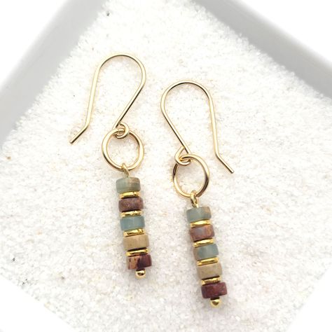 Minimalist style with these 14k gold filled earrings with Aqua Terra jasper beads * Earrings are made from quality 14k gold filled wire, they measure approximately 1.5" in length. * Polished to a high shine * Sent in a Gift Box with Polishing Cloth * Handmade in Montana Boho Earrings Diy, Wooden Bead Earrings, Earrings Handmade Boho, Bijoux Fil Aluminium, Plastic Pouch, Aqua Terra, Wire Jewelry Designs, Gold Dangle Earrings, Handmade Earrings Beaded