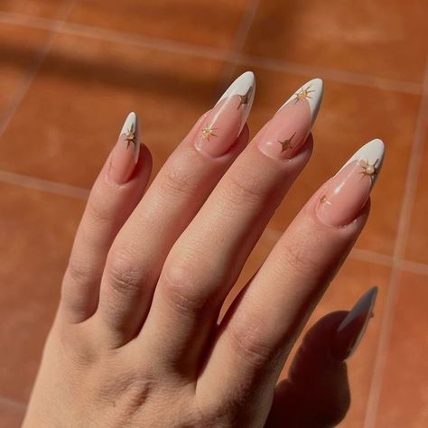 Acrylics With Gold Accents, Acrylic Accent Nail Ideas, French Tip Nails Gold Accent, French Nails With Gold Stars, White Almond Nails With Gold Design, Eid Nails 2024, Gold White French Tip Nails, White French Tip Nails Gold Accent, Acrylic Nails For Navy Blue Prom Dress