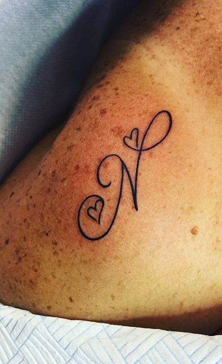 N With Heart Tattoo, N Letter Tattoo Design, N Heart Tattoo, Letter N Tattoo, Letter Tattoos On Hand, N Tattoo, Alphabet Tattoo Designs, Tattoo Lettering Design, Tasteful Tattoos